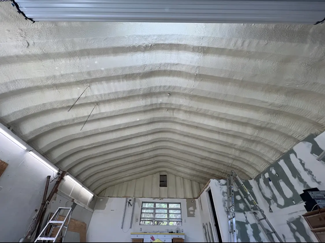 Spray polyurethane foam applied to the underside of a metal roof deck in West Carrollton